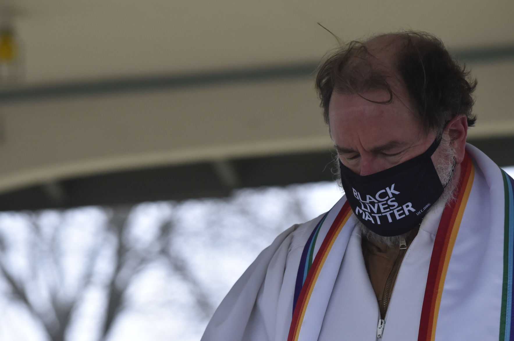 Black Lives Matter mask on a pastor